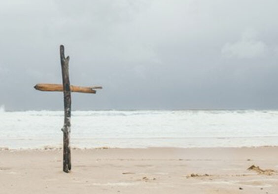 Cross made from wood on the beach